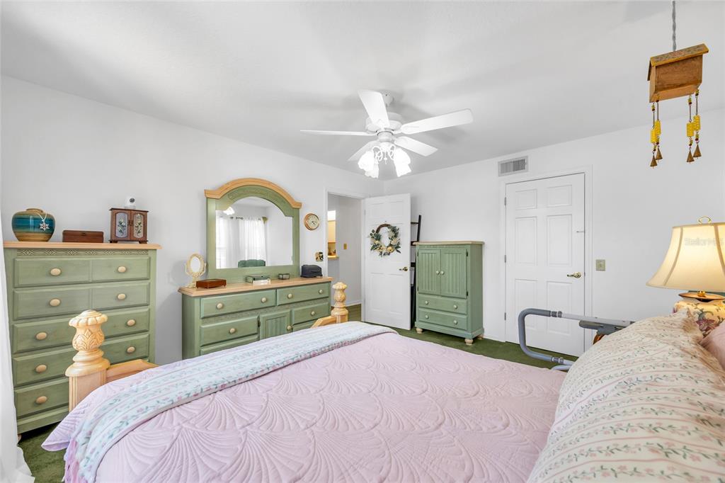 1217 Edgewood Ranch Road Orlando, FL 32835 - Photo 37 of 91 a bedroom with a bed and a dresser