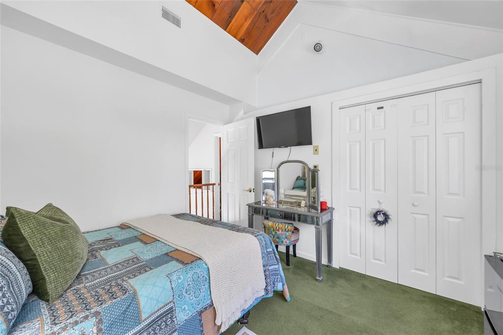 1217 Edgewood Ranch Road Orlando, FL 32835 - Photo 55 of 91 a bedroom with a bed and a tv