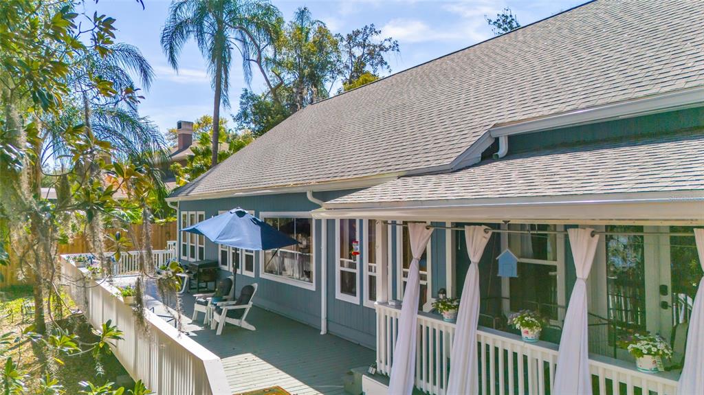 1217 Edgewood Ranch Road Orlando, FL 32835 - Photo 60 of 91 a patio with table and chairs and potted plants