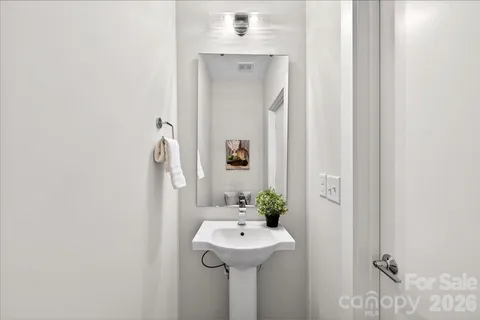a bathroom with a sink and mirror