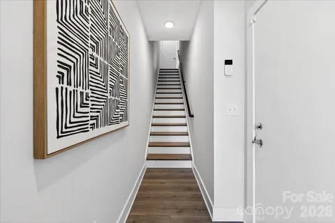 a view of a hallway with stairs