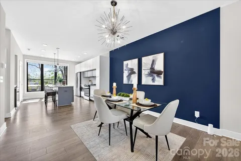 a dining room with furniture and window