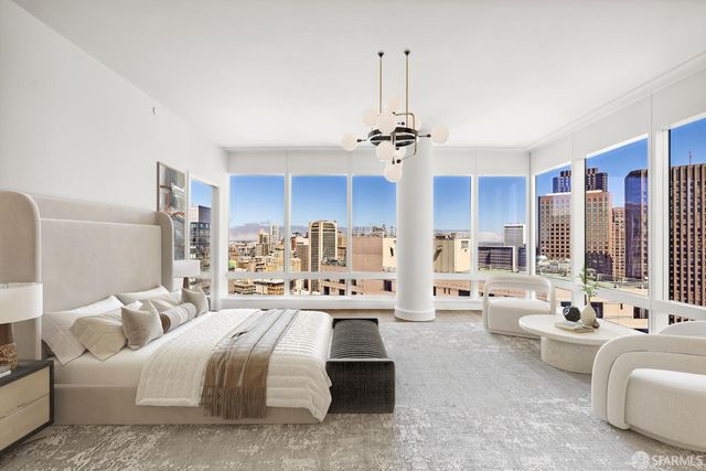 a bedroom with furniture and a chandelier