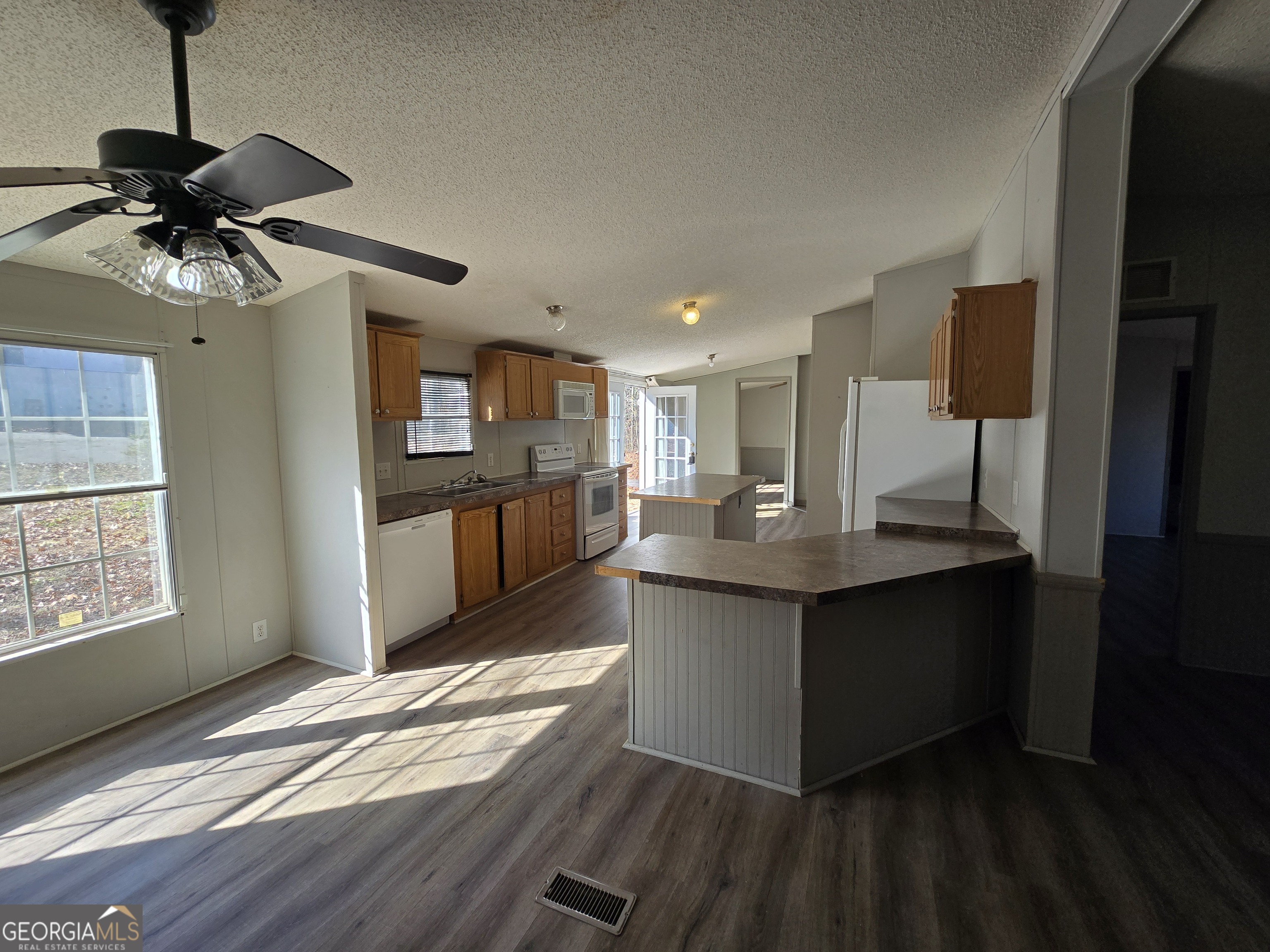 122 Puckett Road Southeast Emerson, GA 30137 - Photo 4 of 17 a kitchen with stainless steel appliances granite countertop a sink and a stove