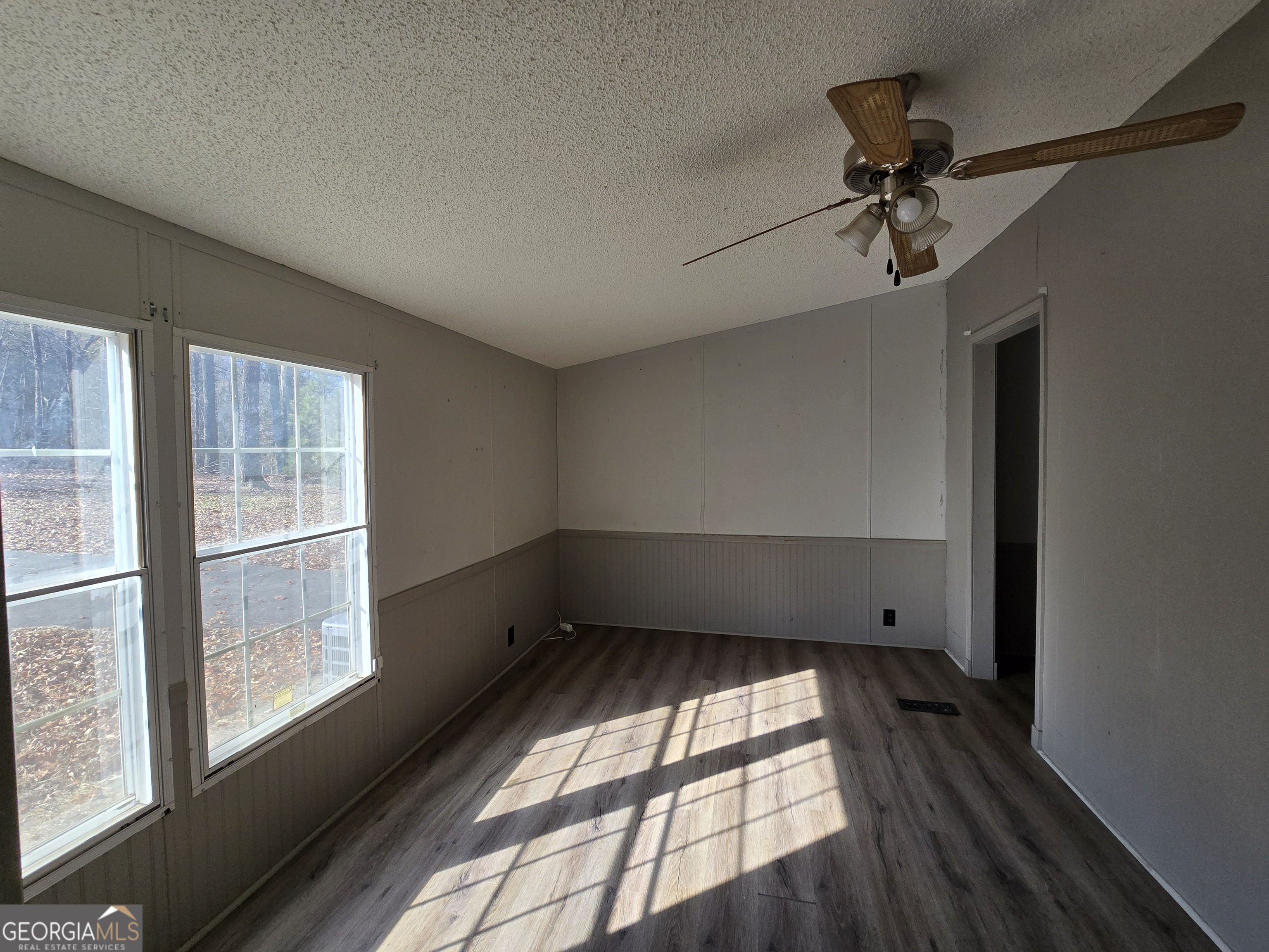 122 Puckett Road Southeast Emerson, GA 30137 - Photo 10 of 17 a view of empty room with wooden floor and fan