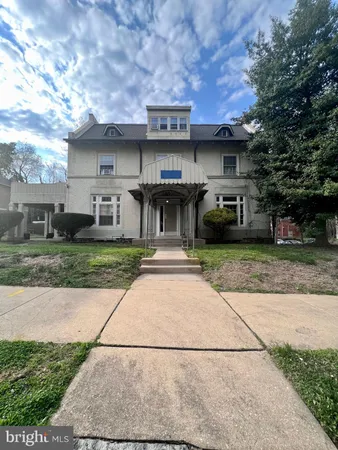 a view of a car parked in front of a building