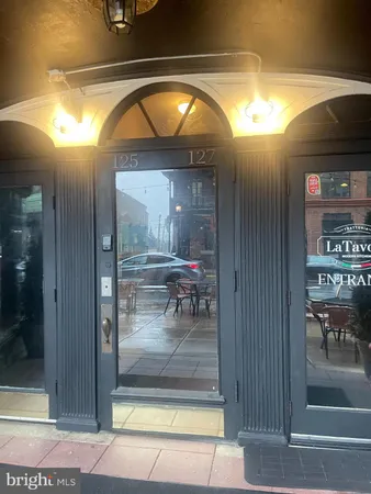 a view of living room and hallway with dining room