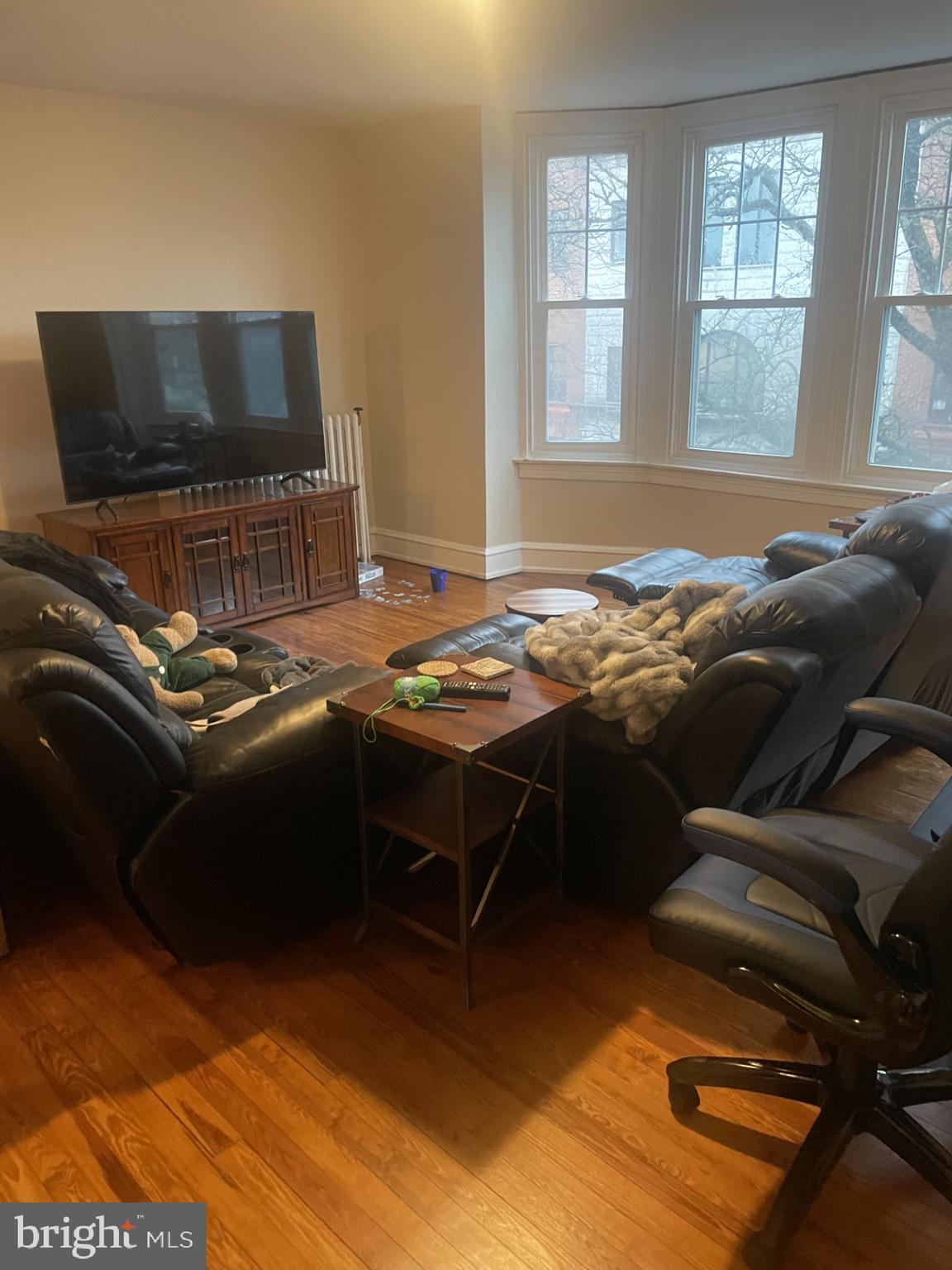 127 State Street, Unit 2 Kennett Square, PA 19348 - Photo 4 of 11 a bedroom with a bed and a flat screen tv