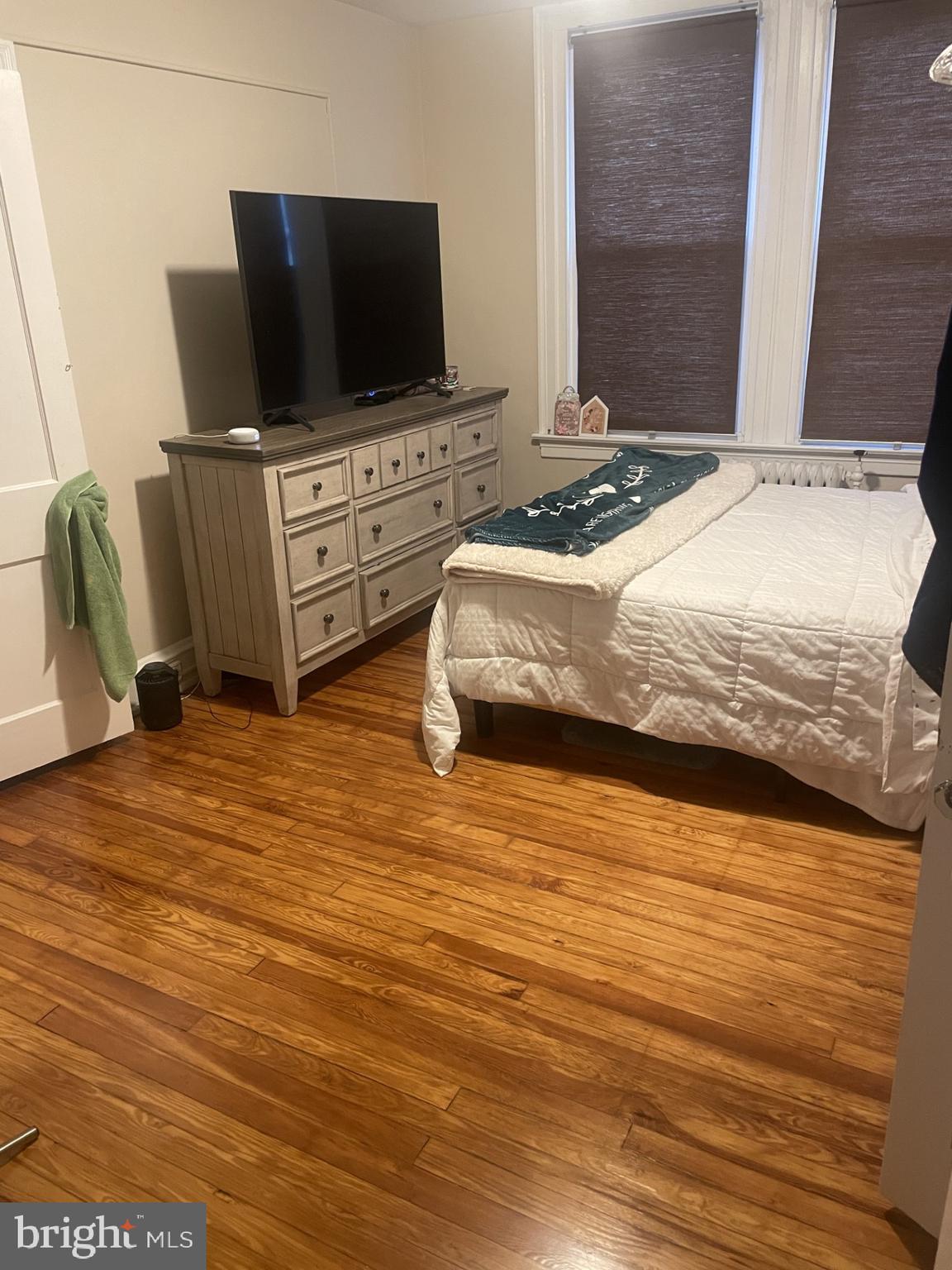 127 State Street, Unit 2 Kennett Square, PA 19348 - Photo 8 of 11 a bedroom with bed and flat screen tv