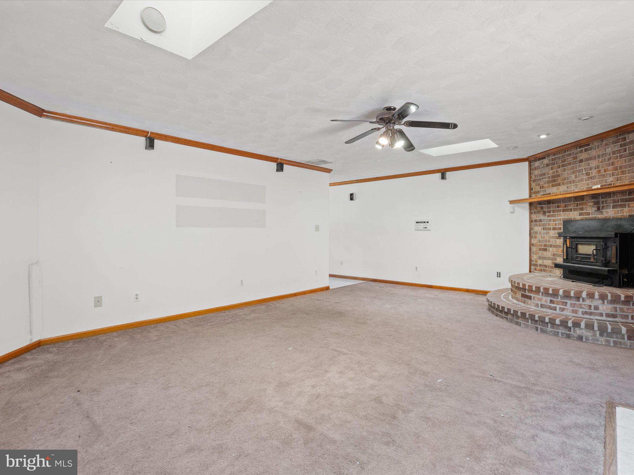 4340 Huntingtown Road Huntingtown, MD 20639 - Photo 13 of 42 a view of an empty room with a ceiling fan and window