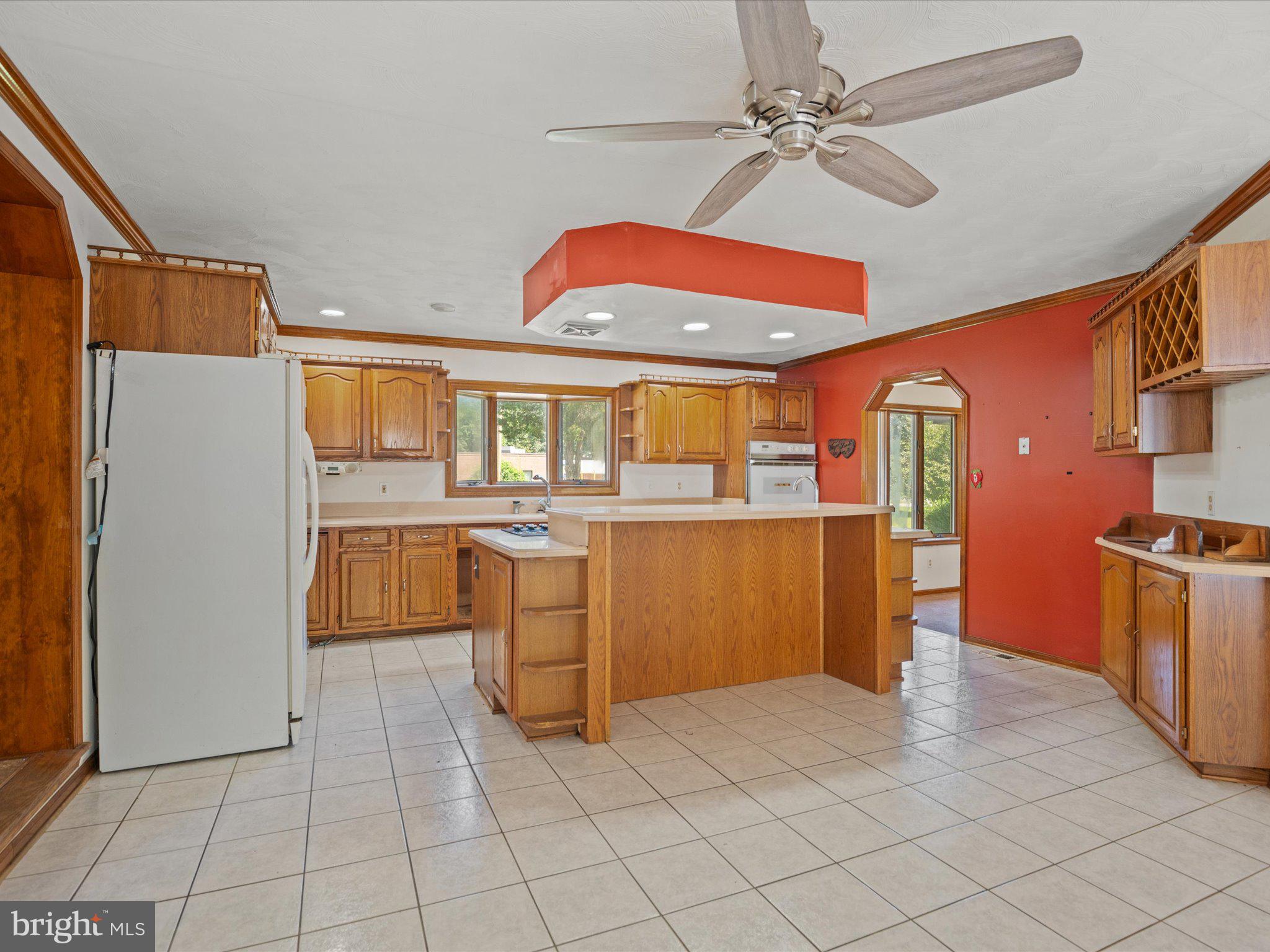4340 Huntingtown Road Huntingtown, MD 20639 - Photo 17 of 42 a kitchen with a sink appliances and cabinets