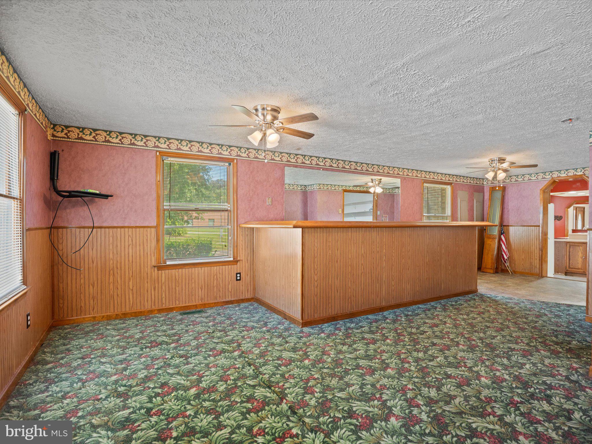 4340 Huntingtown Road Huntingtown, MD 20639 - Photo 22 of 42 an empty room with windows