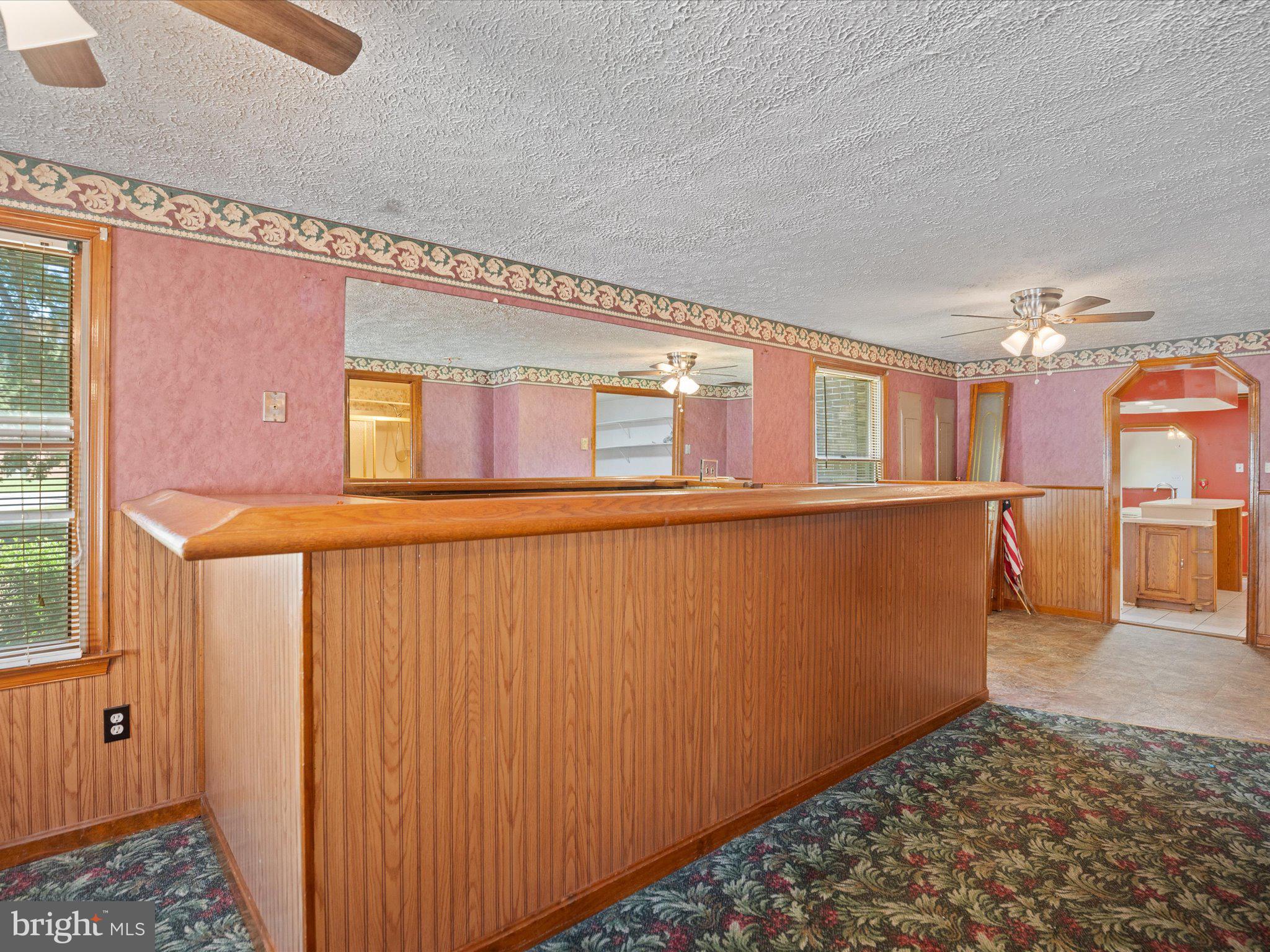 4340 Huntingtown Road Huntingtown, MD 20639 - Photo 23 of 42 a view of a kitchen with wooden floor and a window