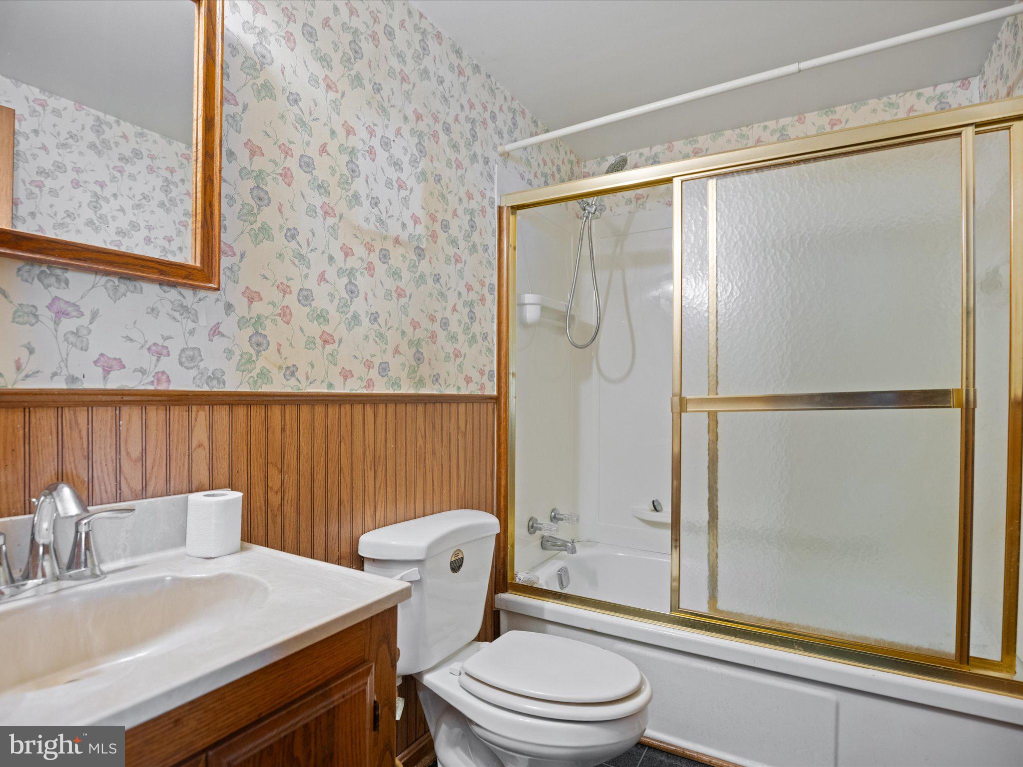 4340 Huntingtown Road Huntingtown, MD 20639 - Photo 25 of 42 a bathroom with a sink toilet and shower