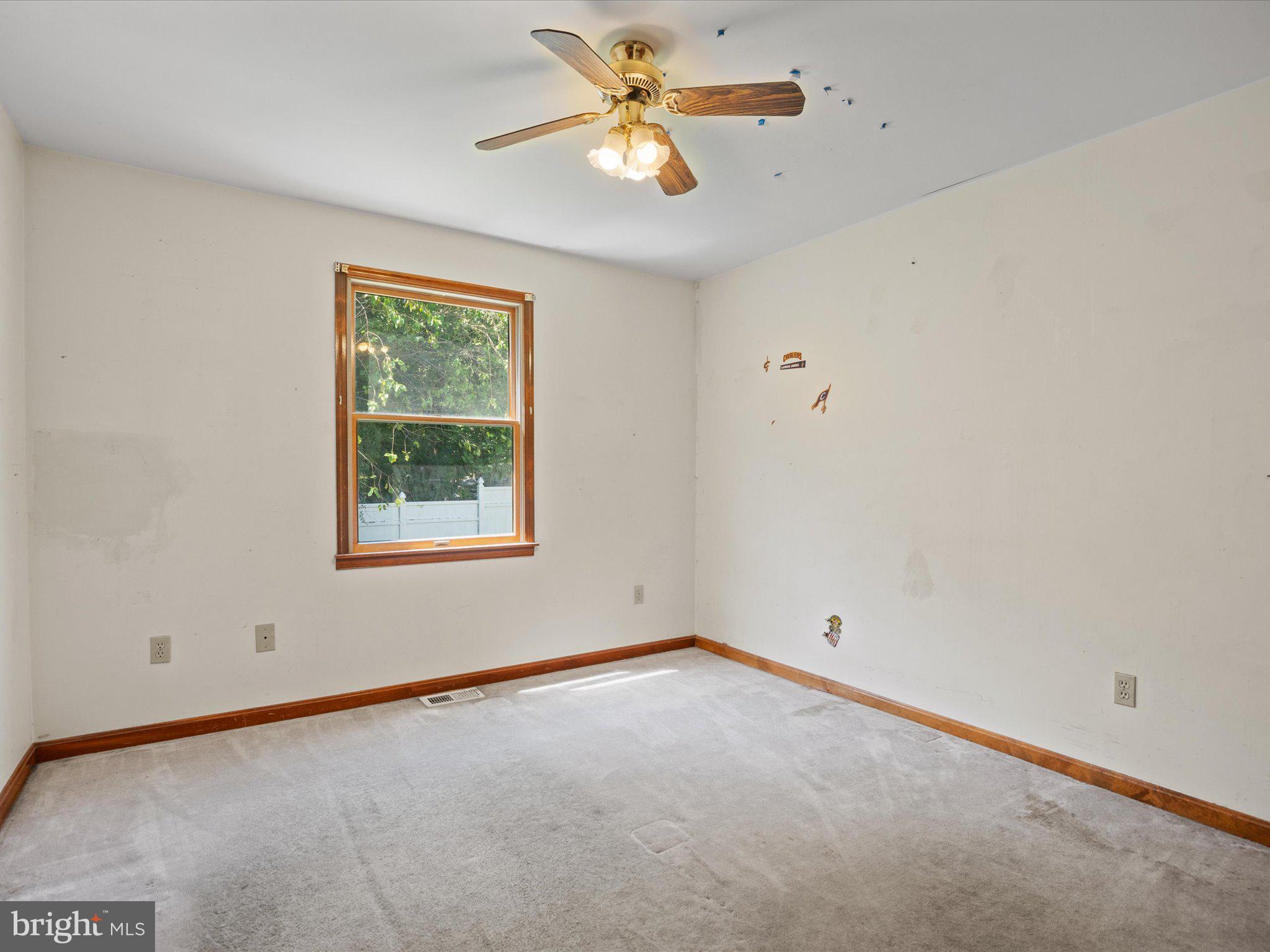 4340 Huntingtown Road Huntingtown, MD 20639 - Photo 34 of 42 an empty room with a window and a fan