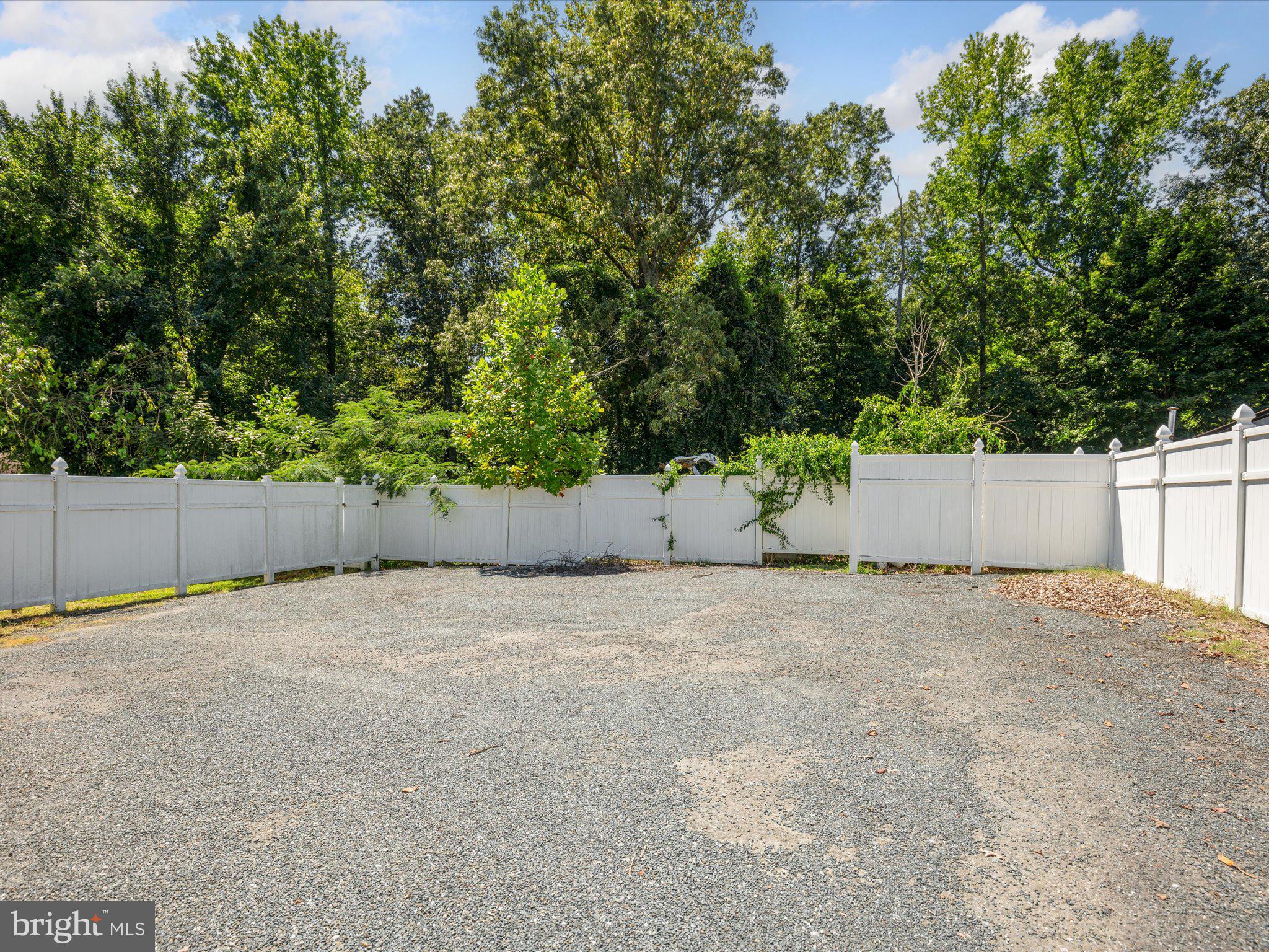 4340 Huntingtown Road Huntingtown, MD 20639 - Photo 37 of 42 a backyard of a house with a yard and garage