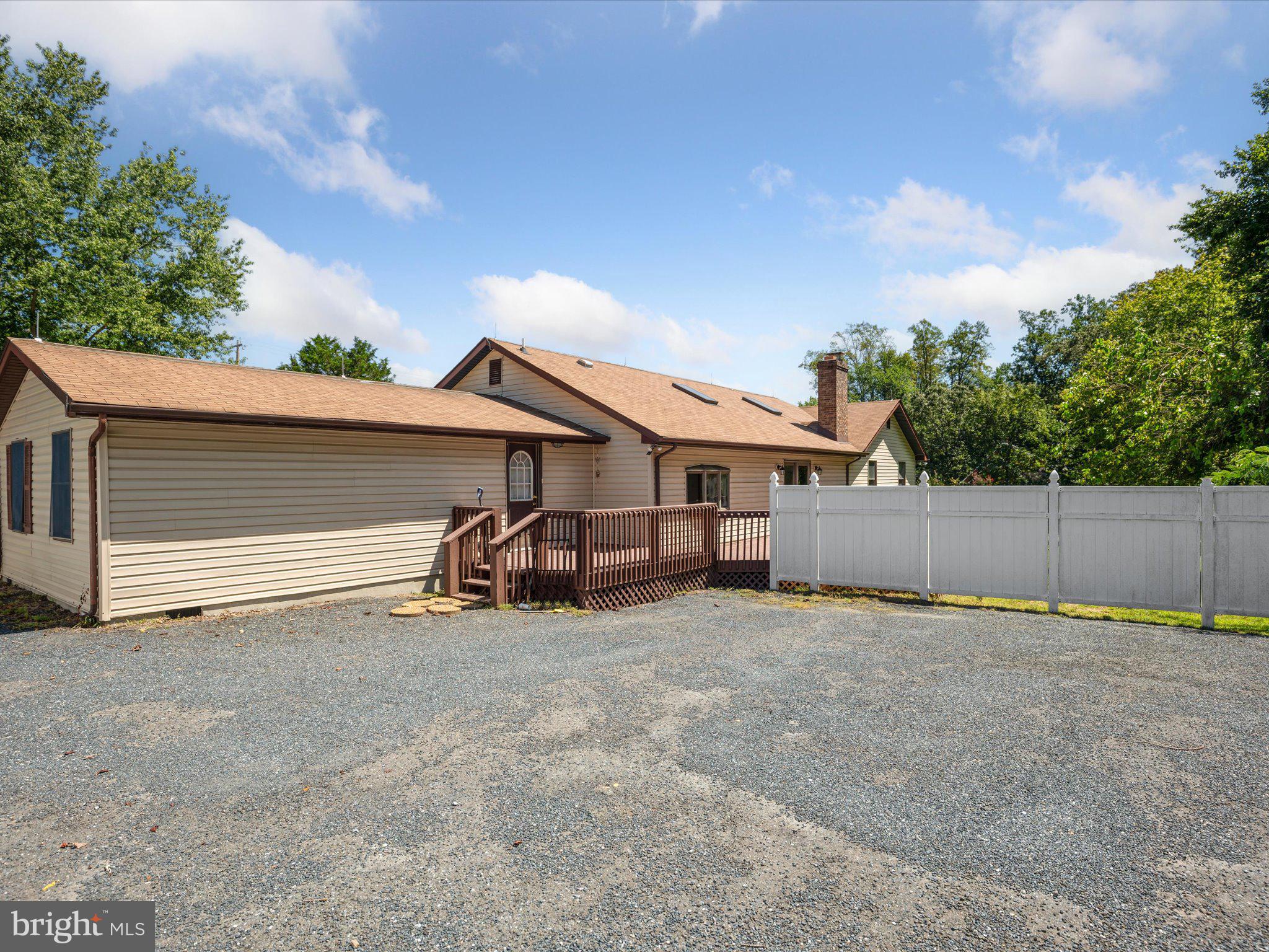 4340 Huntingtown Road Huntingtown, MD 20639 - Photo 38 of 42 a view of a house with a yard and garage
