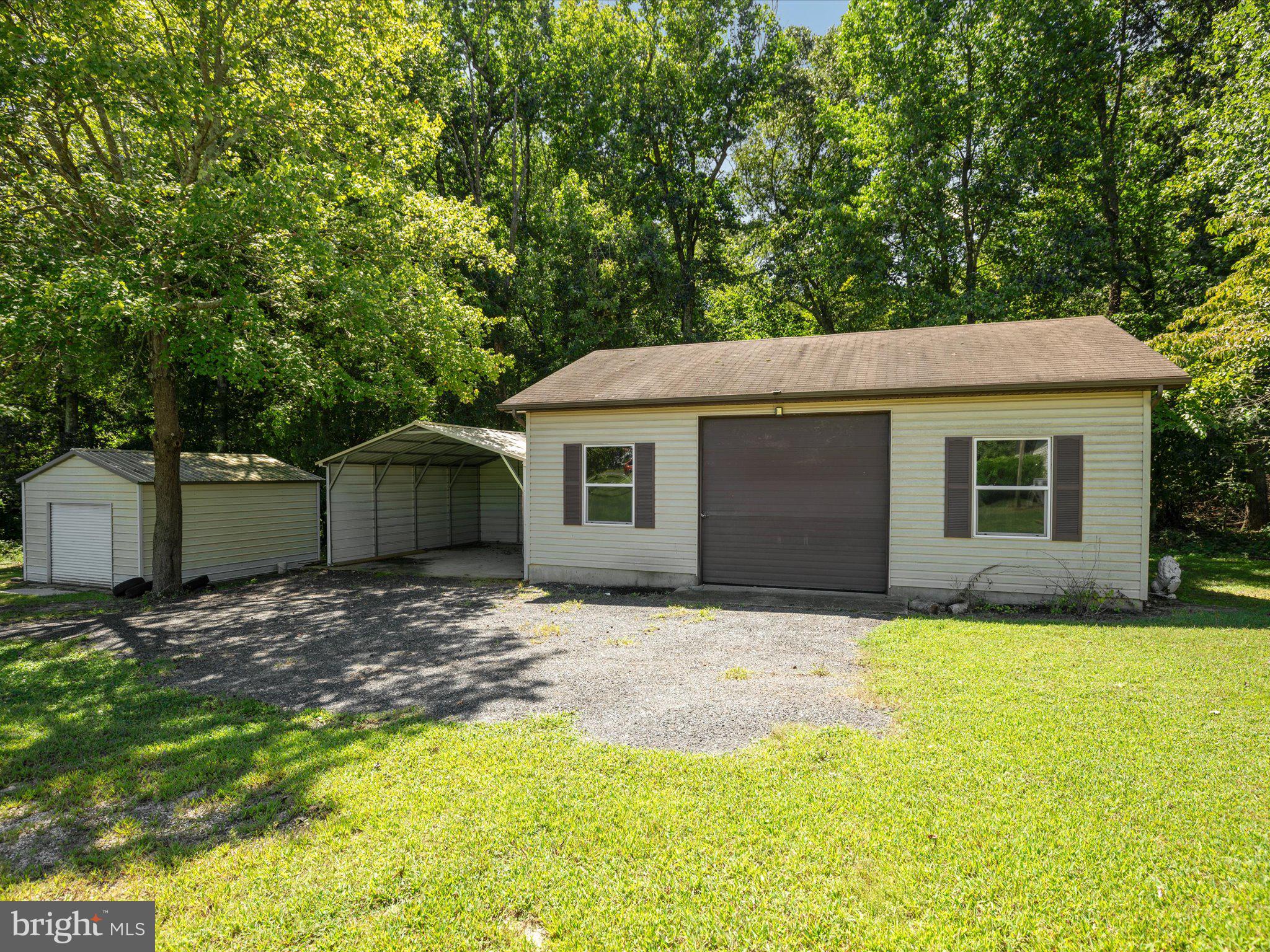 4340 Huntingtown Road Huntingtown, MD 20639 - Photo 40 of 42 a view of a yard in front of a house with large tree