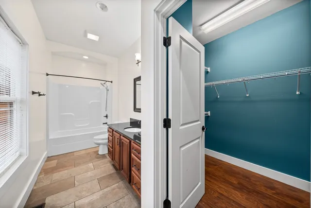a bathroom with a bathtub and a shower