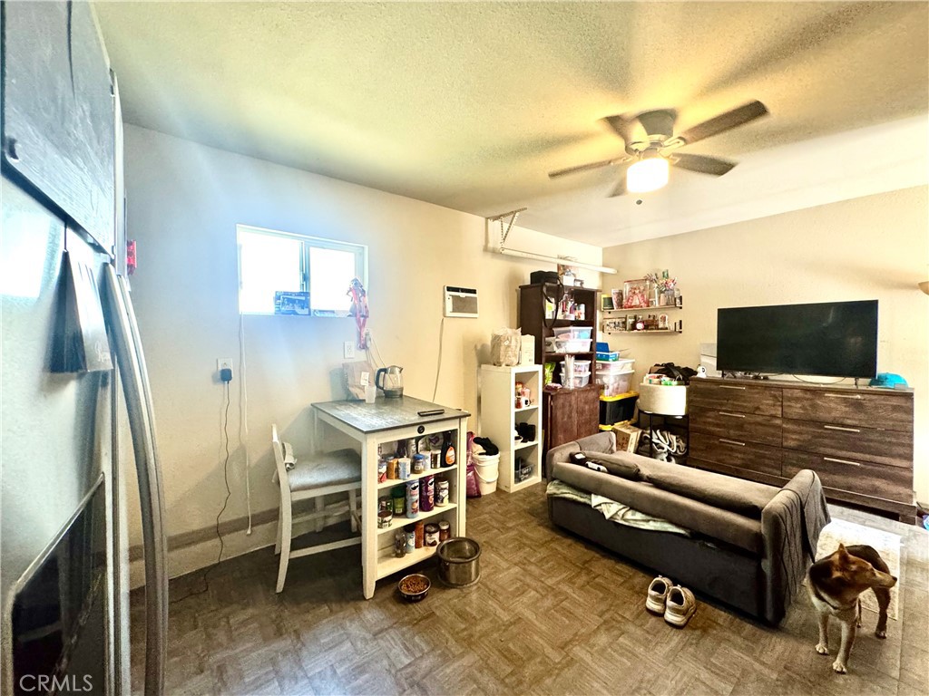 1042 North Alice Avenue Rialto, CA 92376 - Photo 16 of 31 a living room with furniture and a flat screen tv