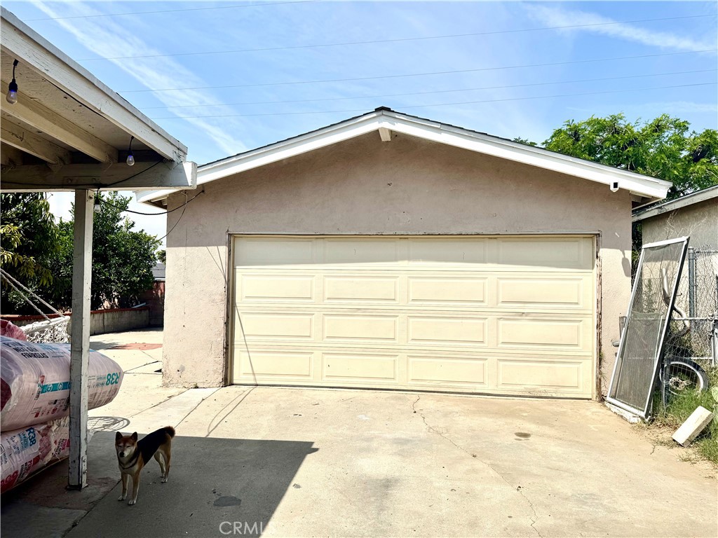 1042 North Alice Avenue Rialto, CA 92376 - Photo 19 of 31 a backyard of a house with lawn chairs and a barbeque