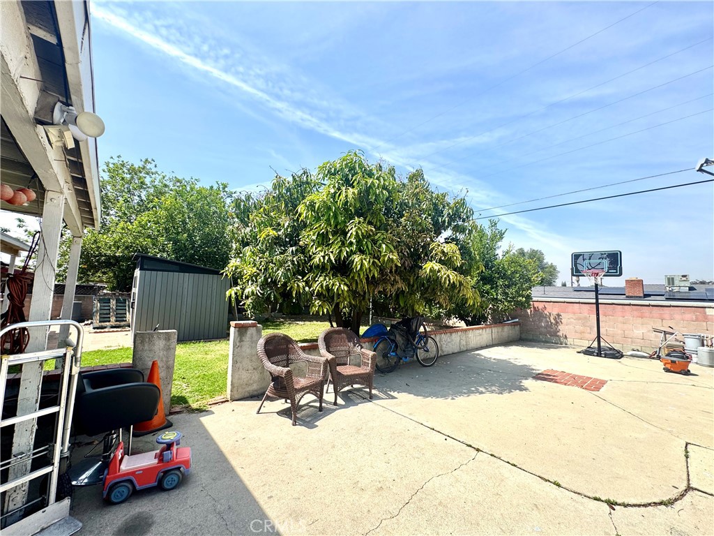 1042 North Alice Avenue Rialto, CA 92376 - Photo 21 of 31 a view of backyard with barbeque grill and seating space