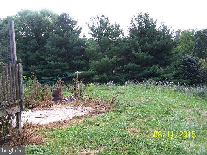 105 Hill Road, Unit 1 Hanover, PA 17331 - Photo 1 of 1 a backyard of a house with lots of green space and fountain