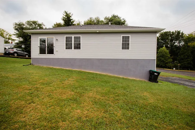 a view of a house with a backyard
