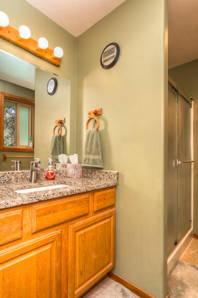 19116 Kiowa Road Bend, OR 97702 - Photo 29 of 38 Master bath with granite countertops & new sink. Walk in shower.