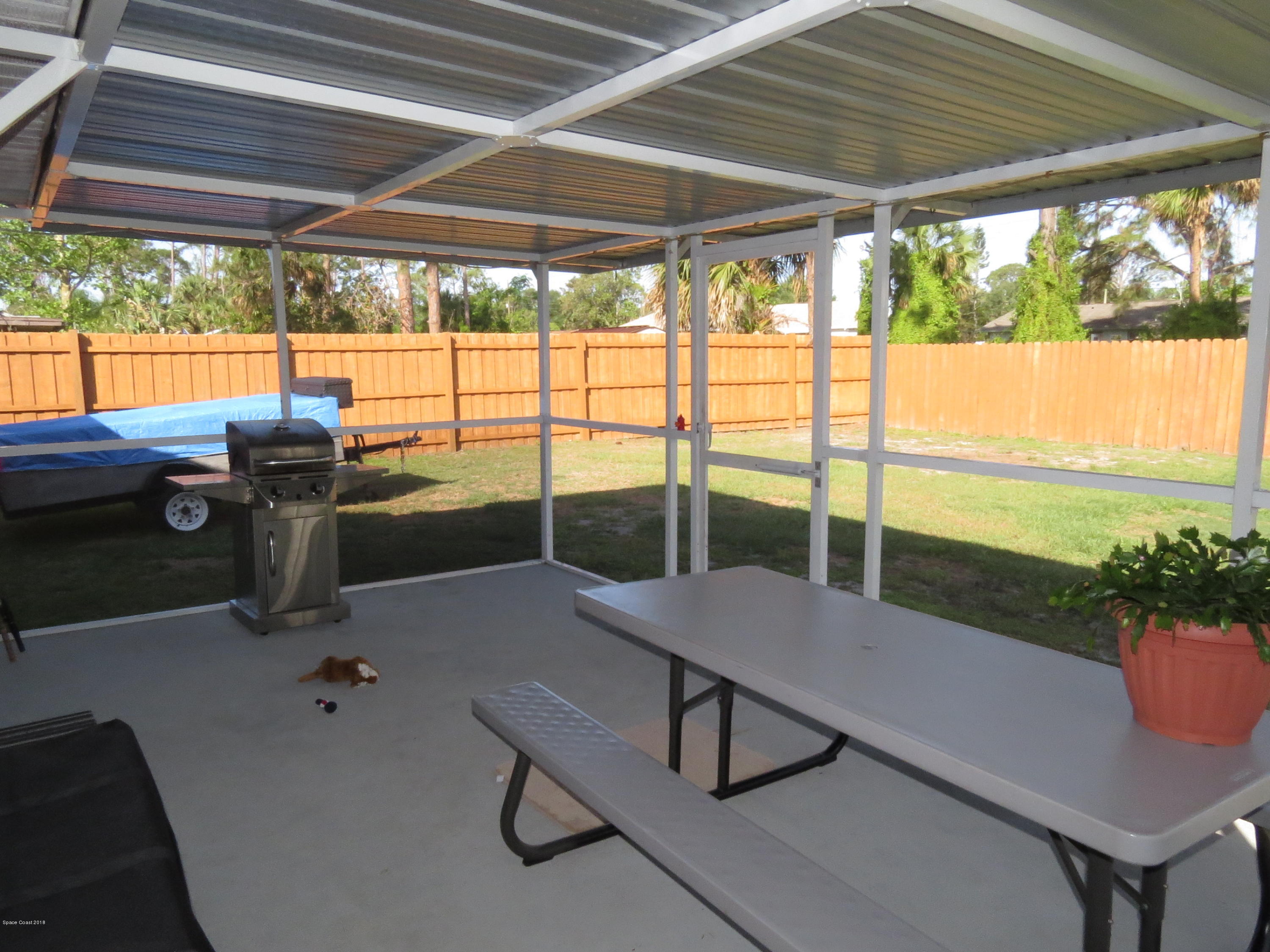 5552 Flint Road Cocoa, FL 32927 - Photo 2 of 21 Screen porch with fenced in yard