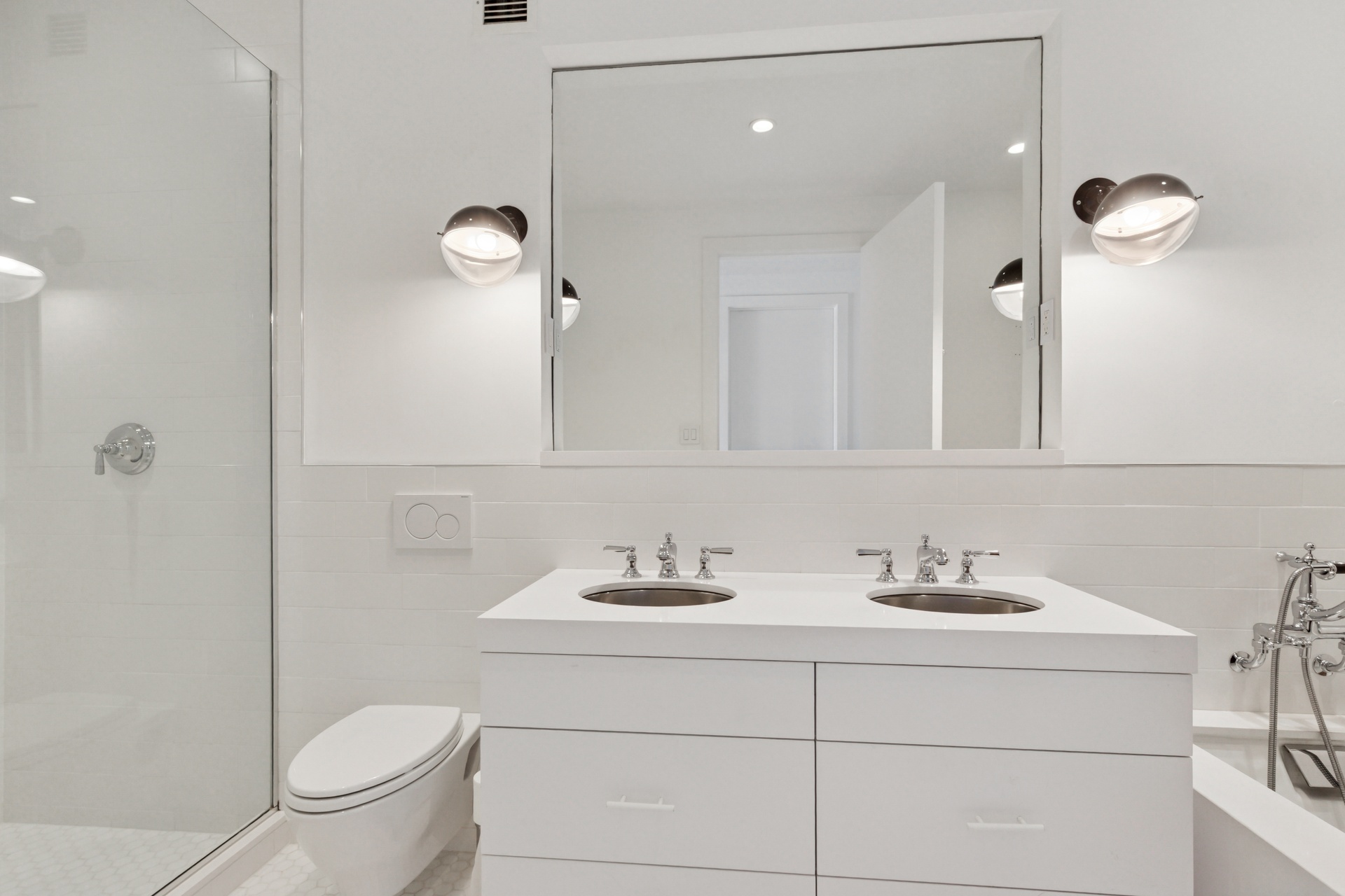 65 West 13th Street, Unit PH1AB Manhattan, NY 10011 - Photo 11 of 27 a bathroom with a sink a toilet and a mirror