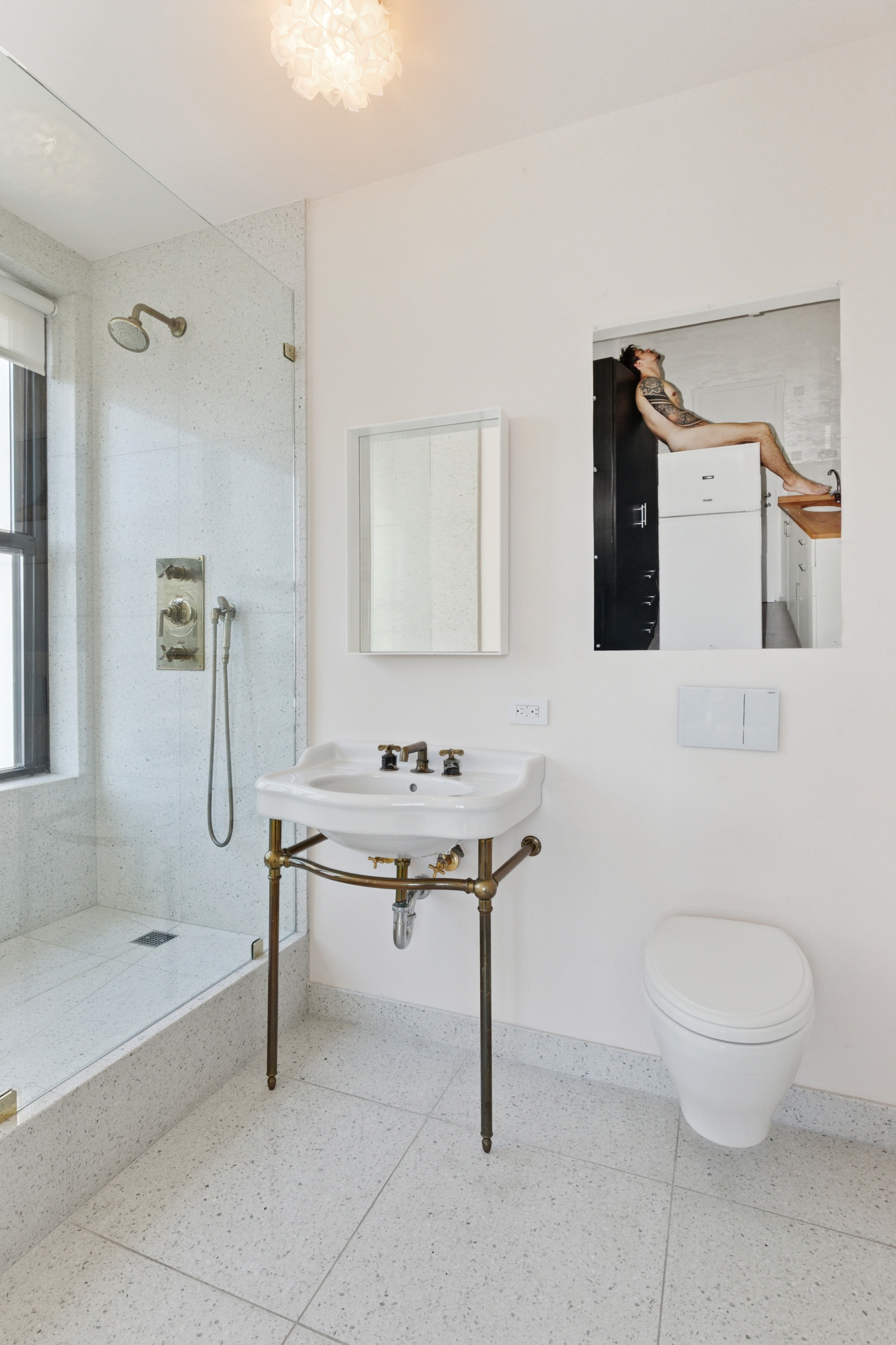 65 West 13th Street, Unit PH1AB Manhattan, NY 10011 - Photo 13 of 27 a bathroom with a sink a toilet and shower