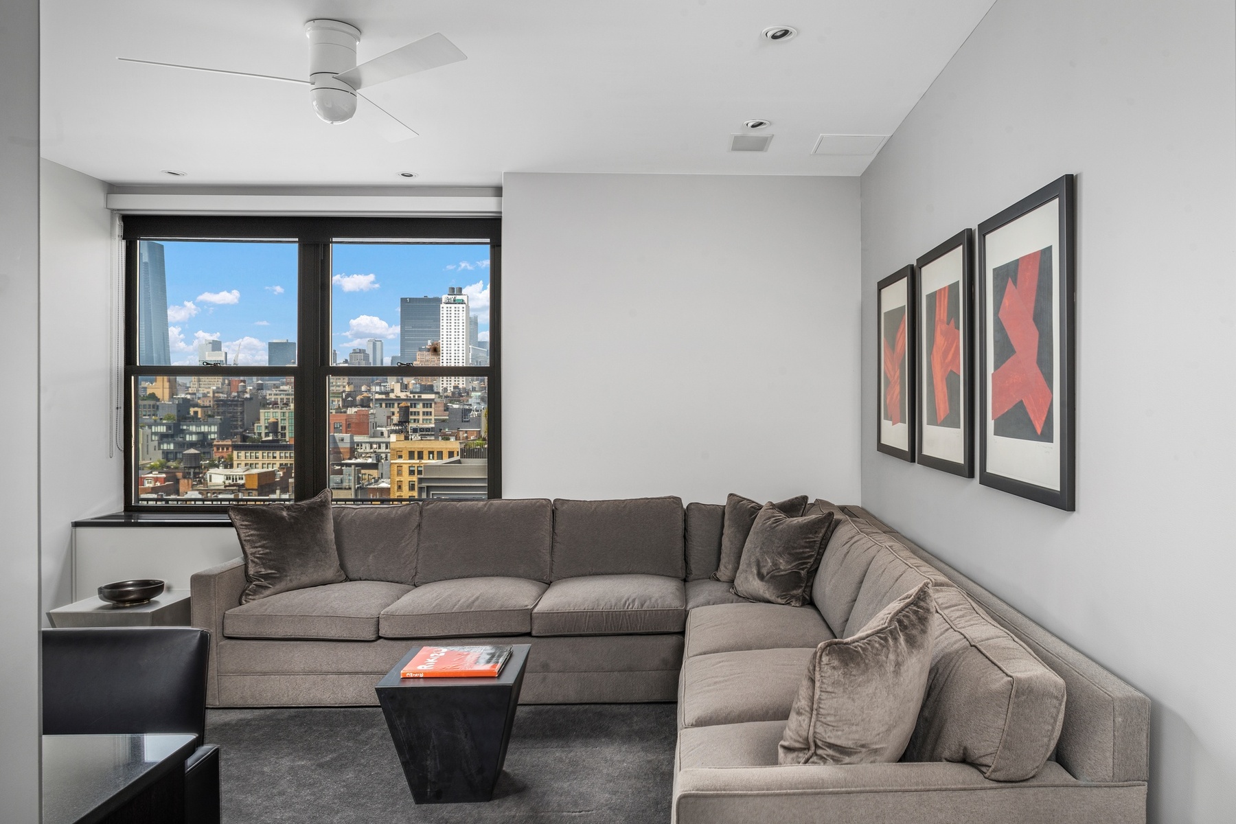 65 West 13th Street, Unit PH1AB Manhattan, NY 10011 - Photo 24 of 27 a living room with furniture and a window