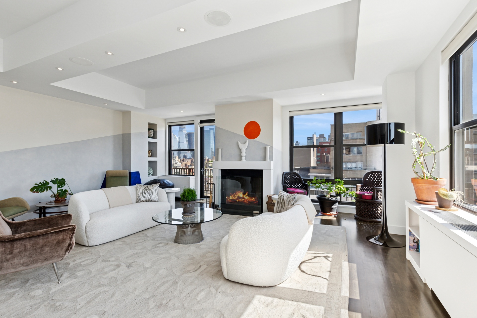 65 West 13th Street, Unit PH1AB Manhattan, NY 10011 - Photo 2 of 27 a living room with furniture a fireplace and a large window