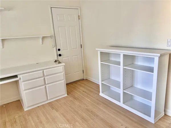 a room with a furniture and wooden floor