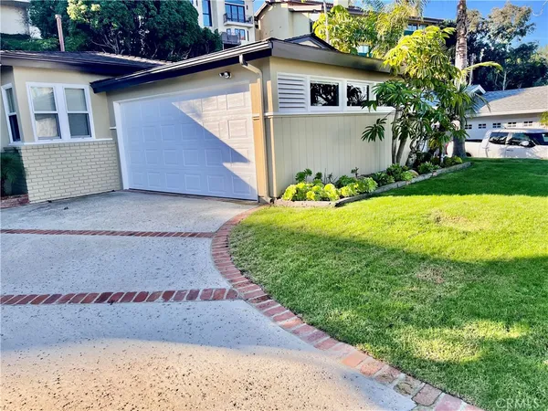 a view of a backyard of the house