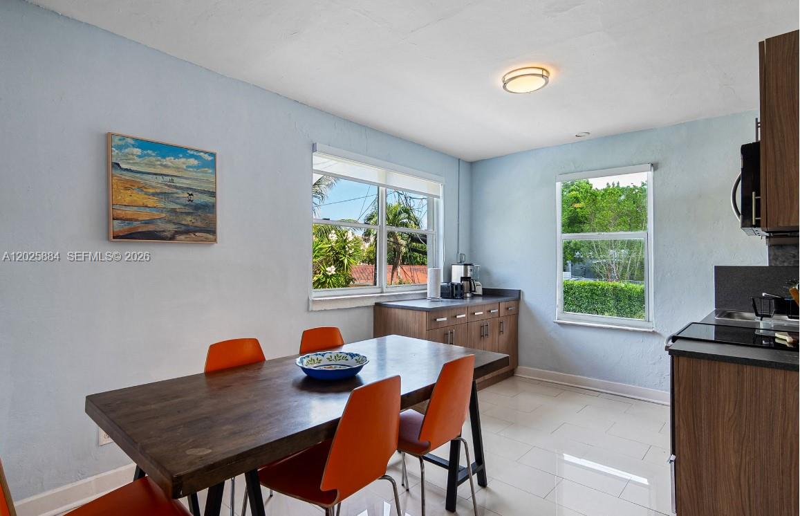 2255 Southwest 10th Street, Unit B Miami, FL 33135 - Photo 12 of 26 a view of a dining room with furniture and a window