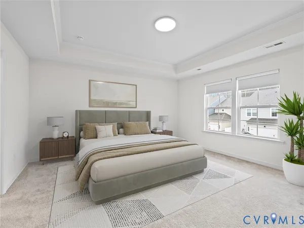 a spacious bedroom with a large bed and a potted plant