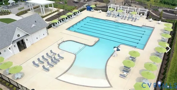 an aerial view of a house with outdoor space patio and outdoor seating