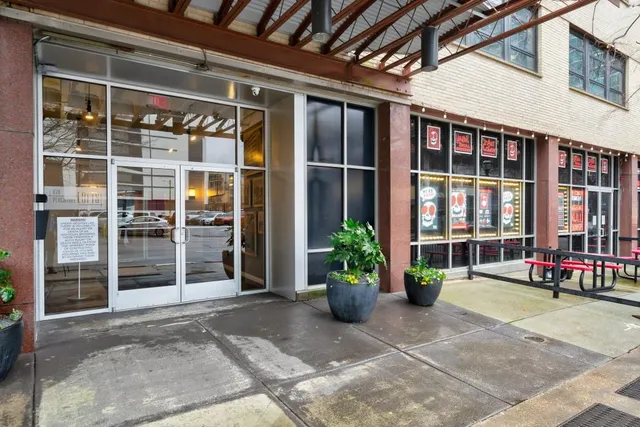a view of front door with outdoor seating