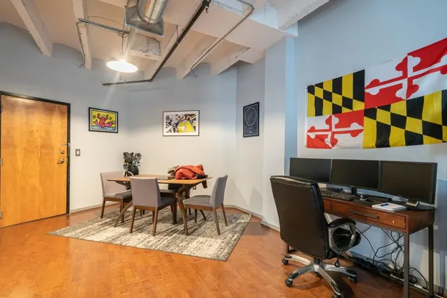 a view of a workspace with furniture