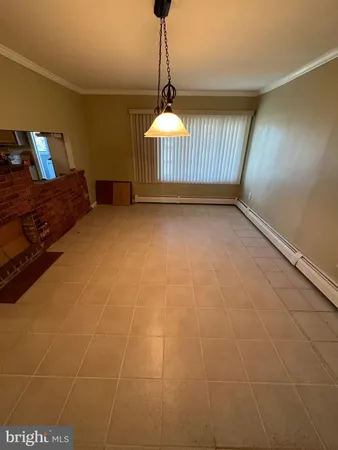 a bedroom with furniture and window