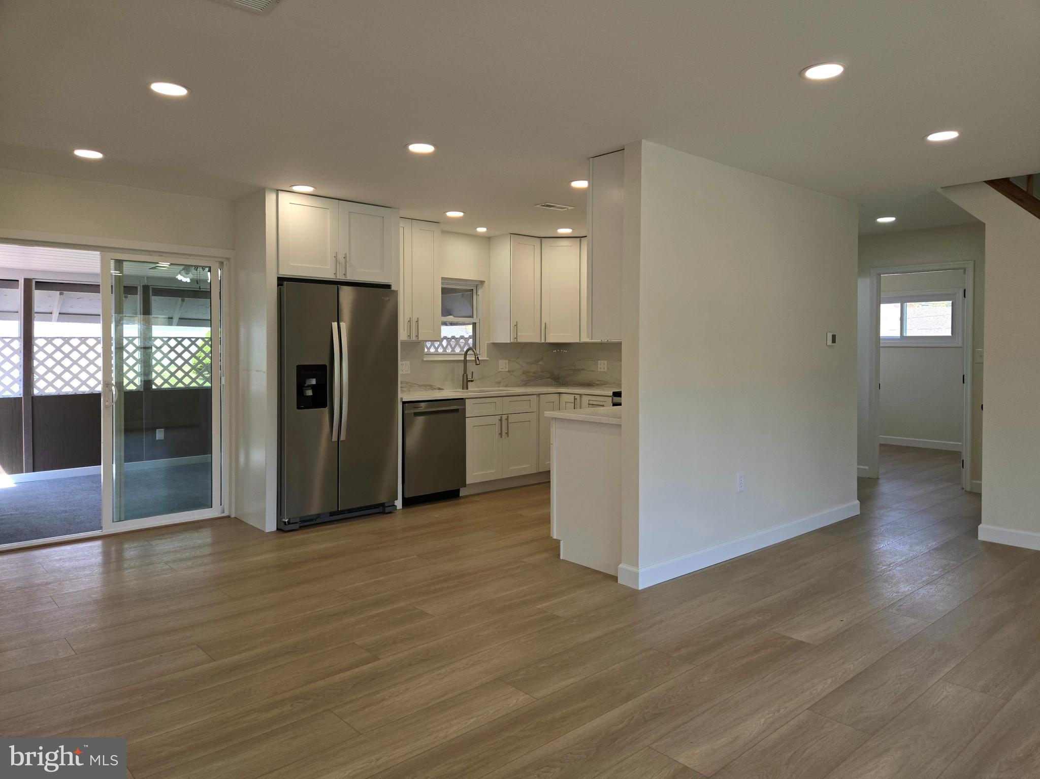 61 Cobalt Cross Road Levittown, PA 19057 - Photo 8 of 30 a view of kitchen with refrigerator and wooden floor