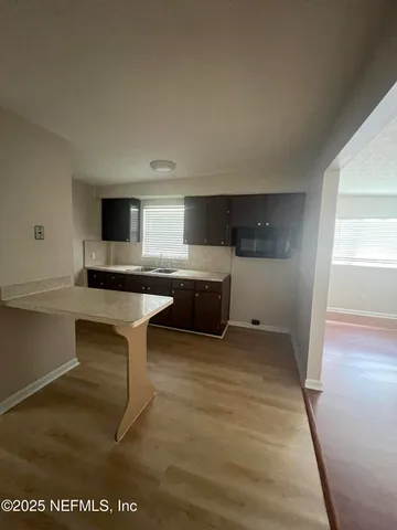 a kitchen with a sink and cabinets