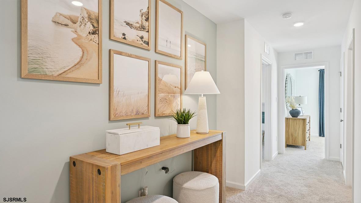 401 Scotty Boulevard, Unit 1106 Rio Grande, NJ 08242 - Photo 25 of 46 a bathroom with a sink a toilet and a mirror