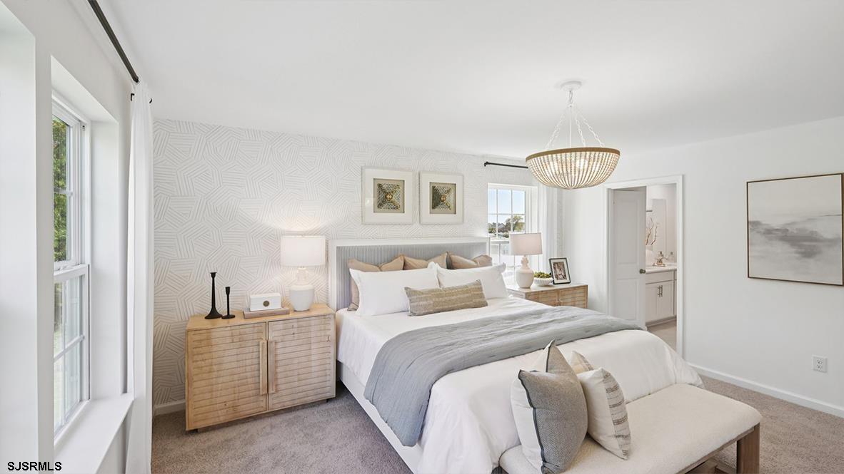 401 Scotty Boulevard, Unit 1106 Rio Grande, NJ 08242 - Photo 30 of 46 a bedroom with a large bed and a window