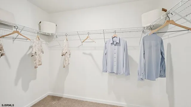 a bathroom with 2 sink and a mirror