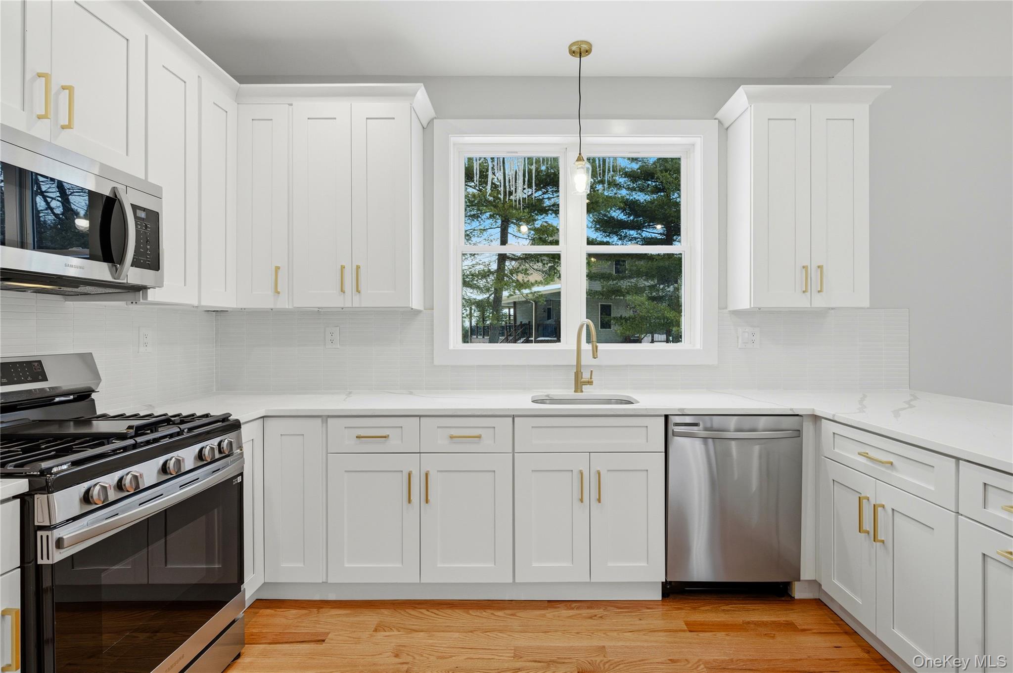 15 Manchester Road Rock Hill, NY 12775 - Photo 11 of 46 a kitchen with white cabinets stainless steel appliances and sink
