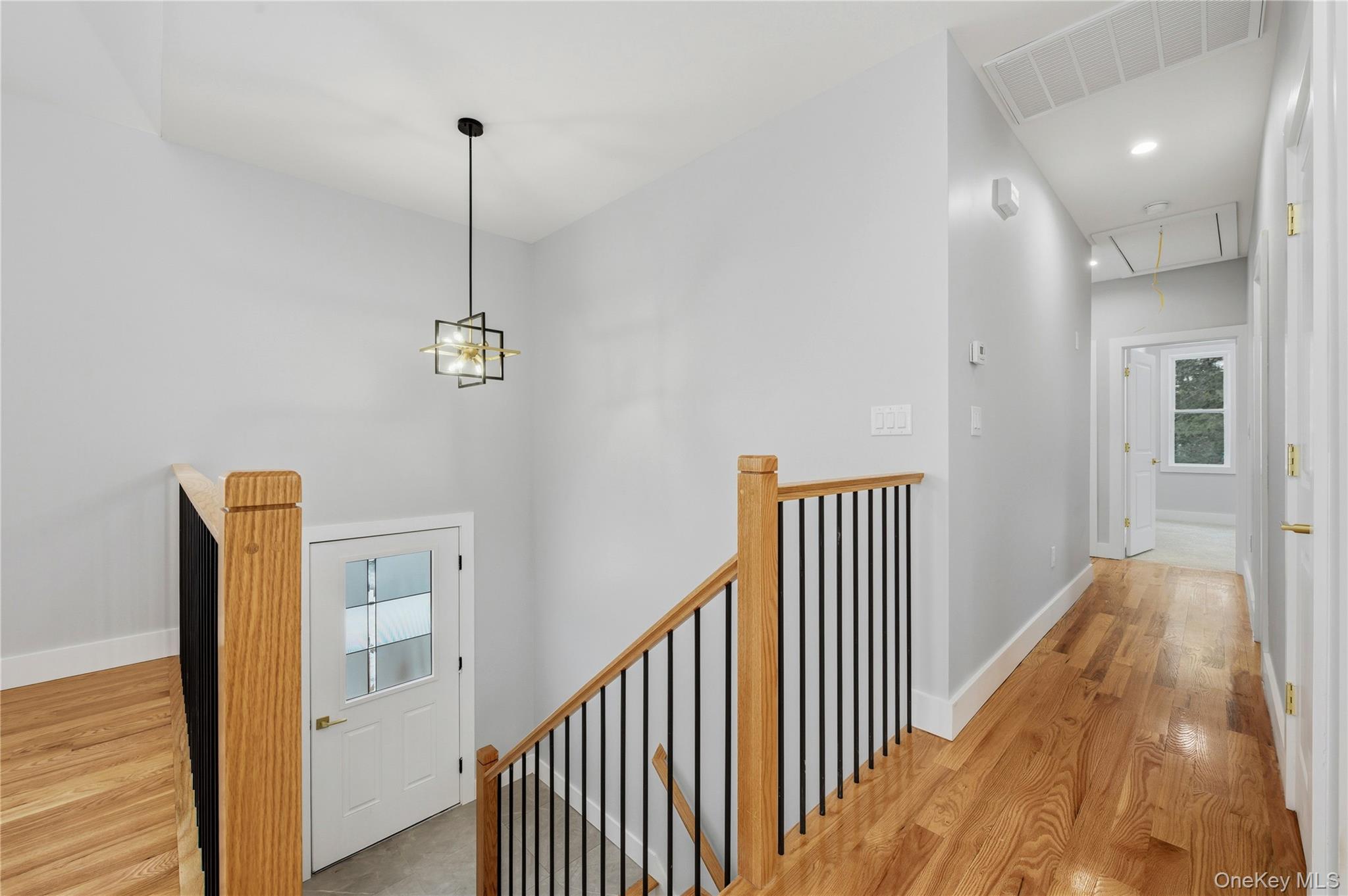 15 Manchester Road Rock Hill, NY 12775 - Photo 12 of 46 a view of a hallway with wooden floor and stairs