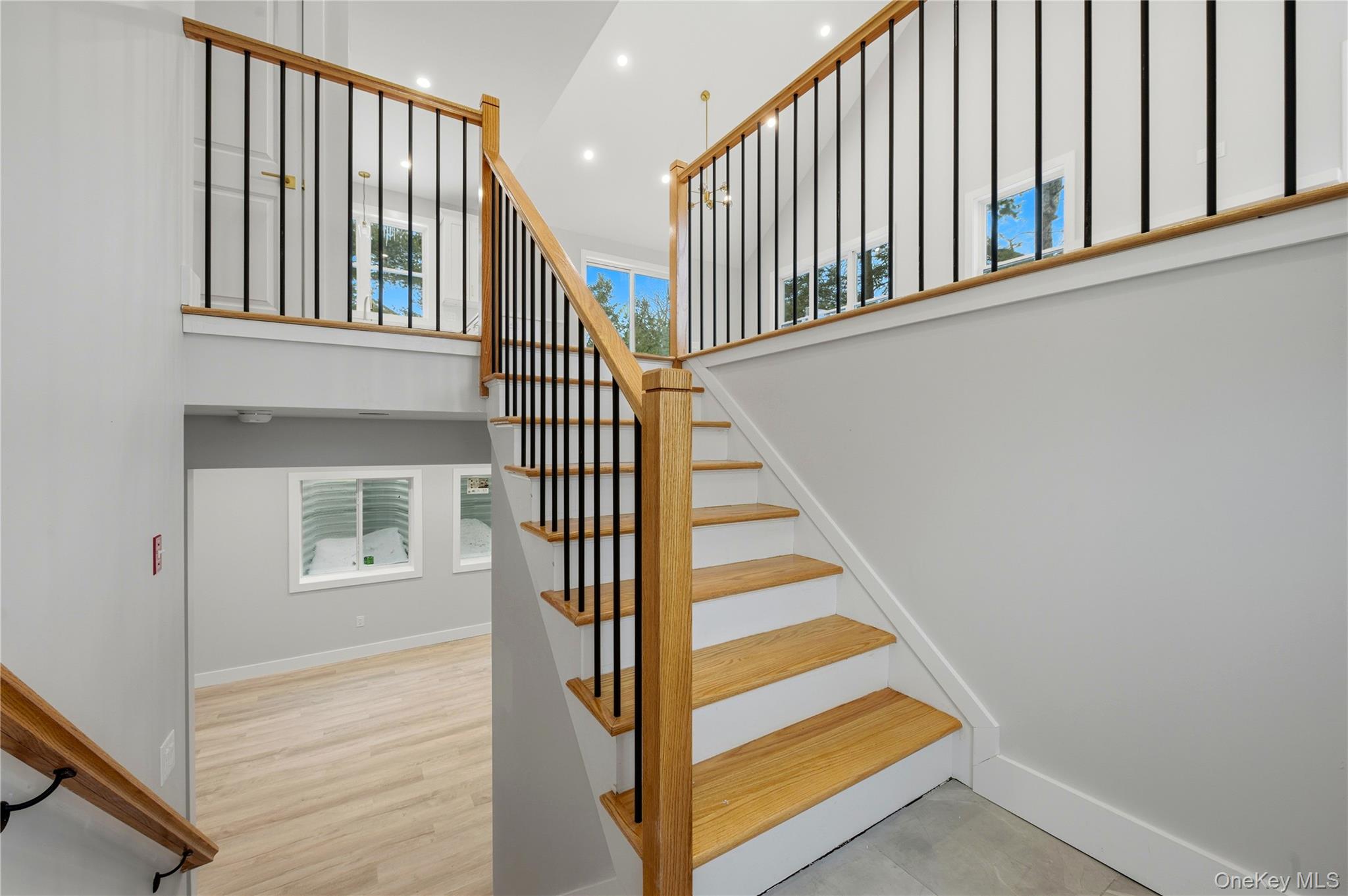 15 Manchester Road Rock Hill, NY 12775 - Photo 27 of 46 a view of staircase with lots of frames on wall and a window